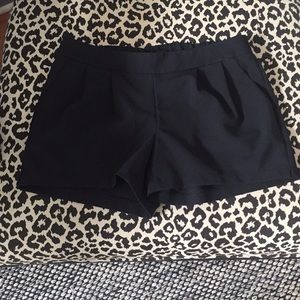 Black pleated shorts